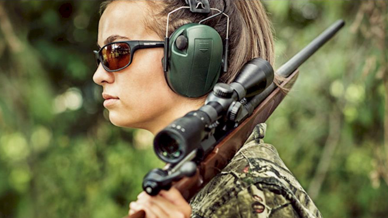 National Rifle Association of America women hunter wearing her eye and ear protection