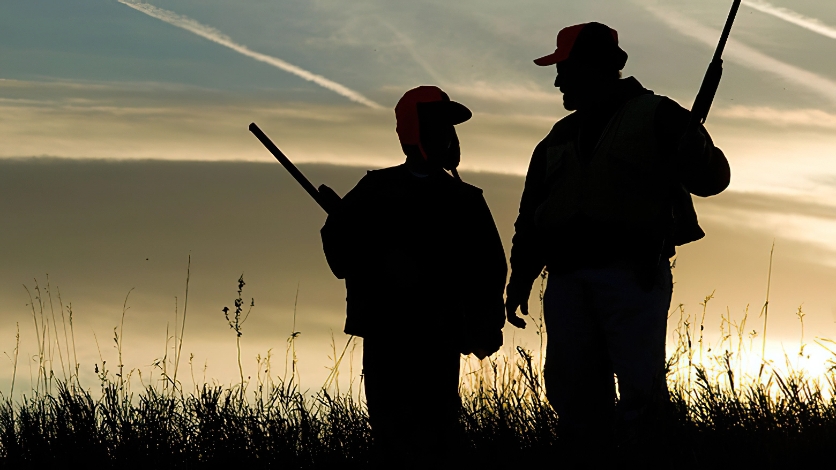 Father and Son Hunting with Shotguns